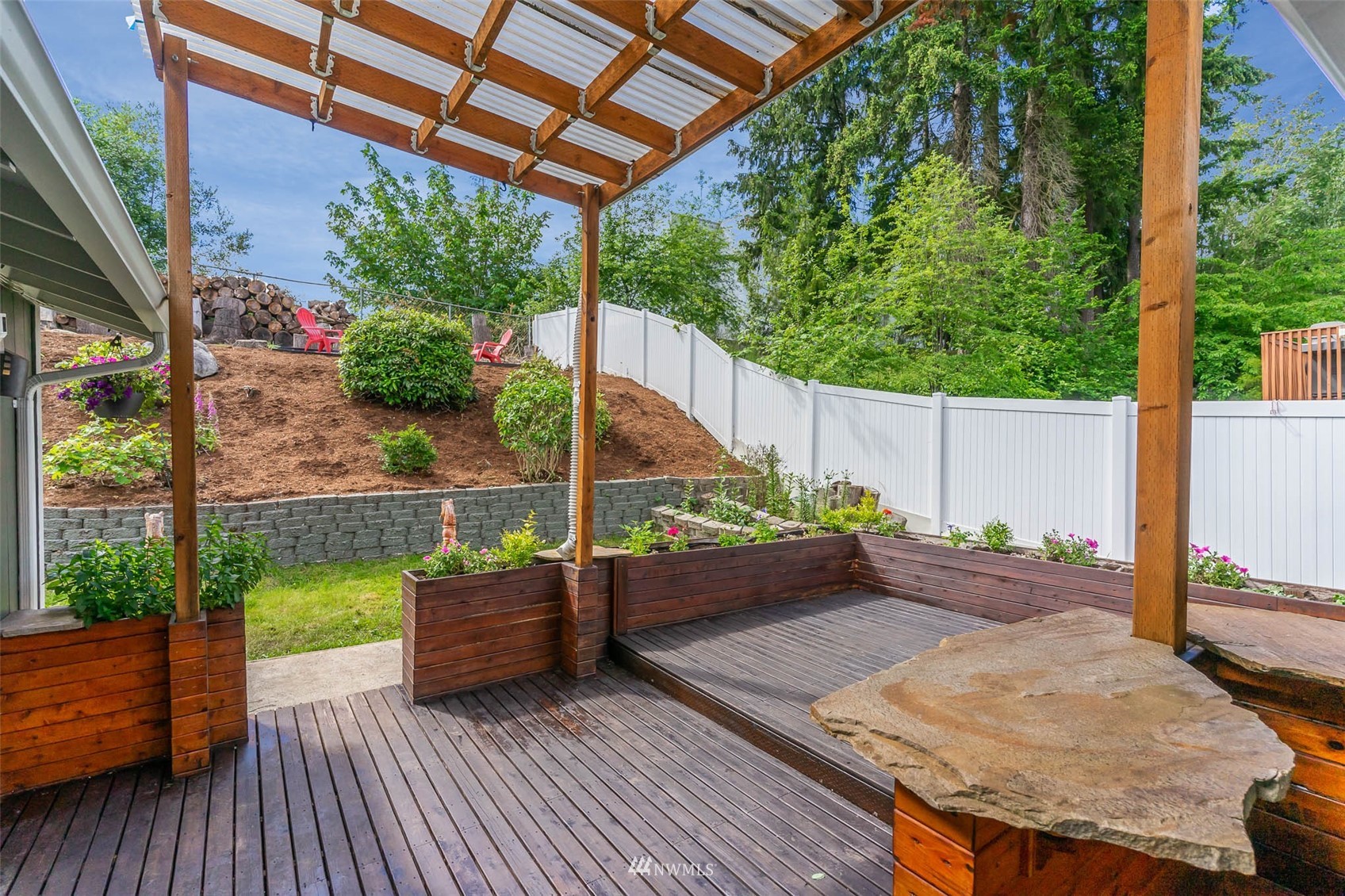 18120 19th Drive Southeast Bothell, WA 98012 - Photo 25 of 31 a wooden bench sitting in front of a building