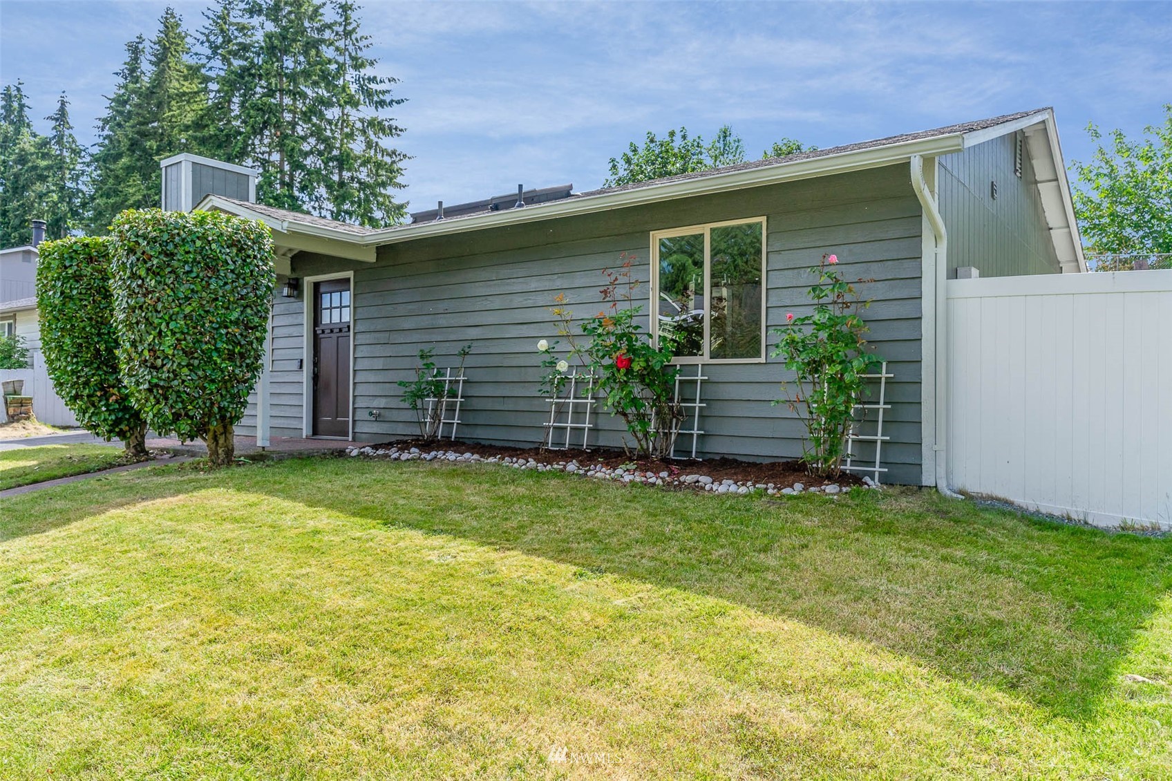 18120 19th Drive Southeast Bothell, WA 98012 - Photo 3 of 31 a front view of a house with a garden