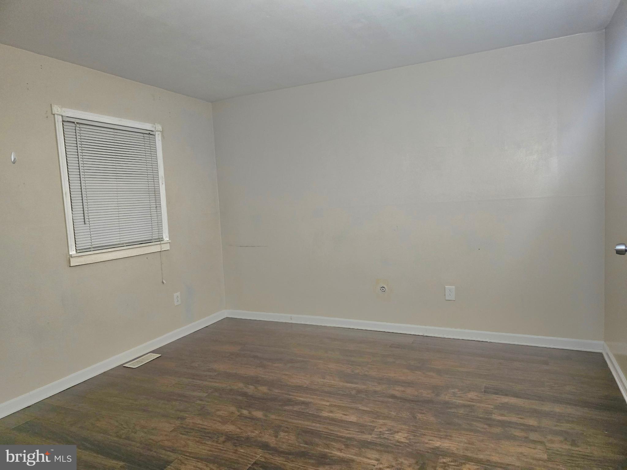 1136 Fox Run Reading, PA 19606 - Photo 16 of 27 a view of an empty room with wooden floor and a window