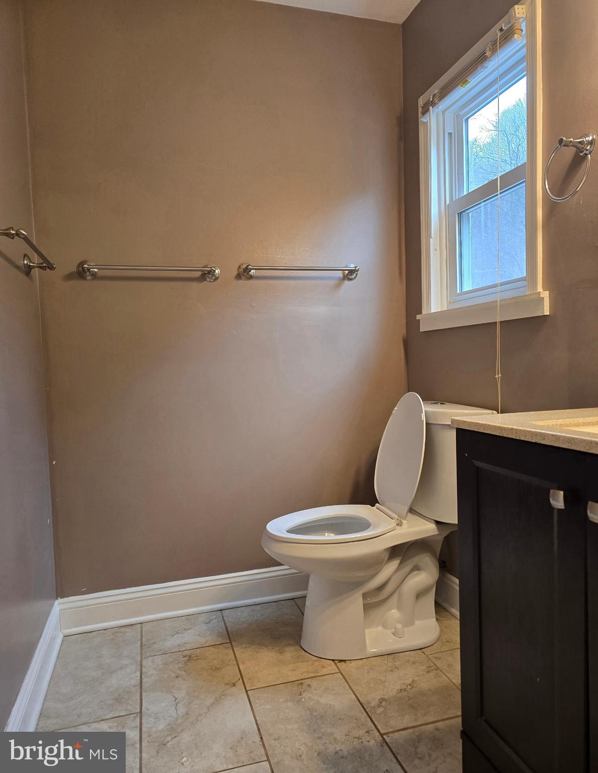 1136 Fox Run Reading, PA 19606 - Photo 19 of 27 a white toilet sitting next to a bathroom sink