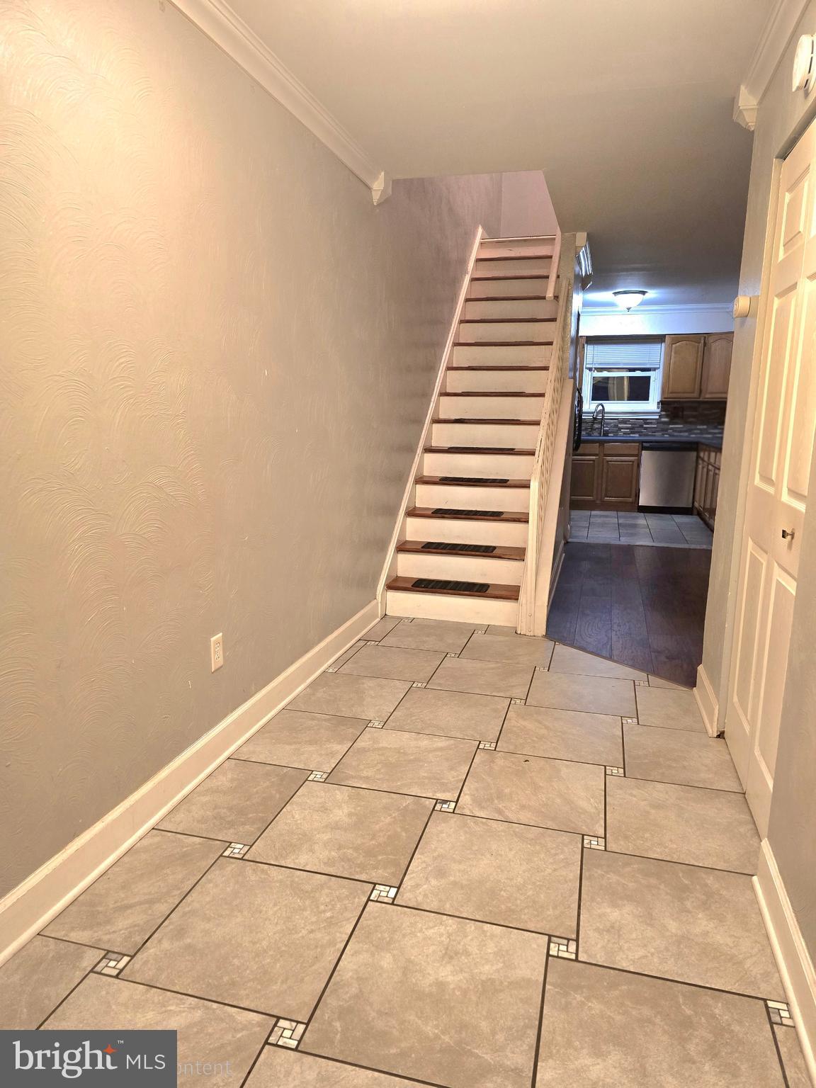 1136 Fox Run Reading, PA 19606 - Photo 3 of 27 a view of a hallway with stairs and wooden floor