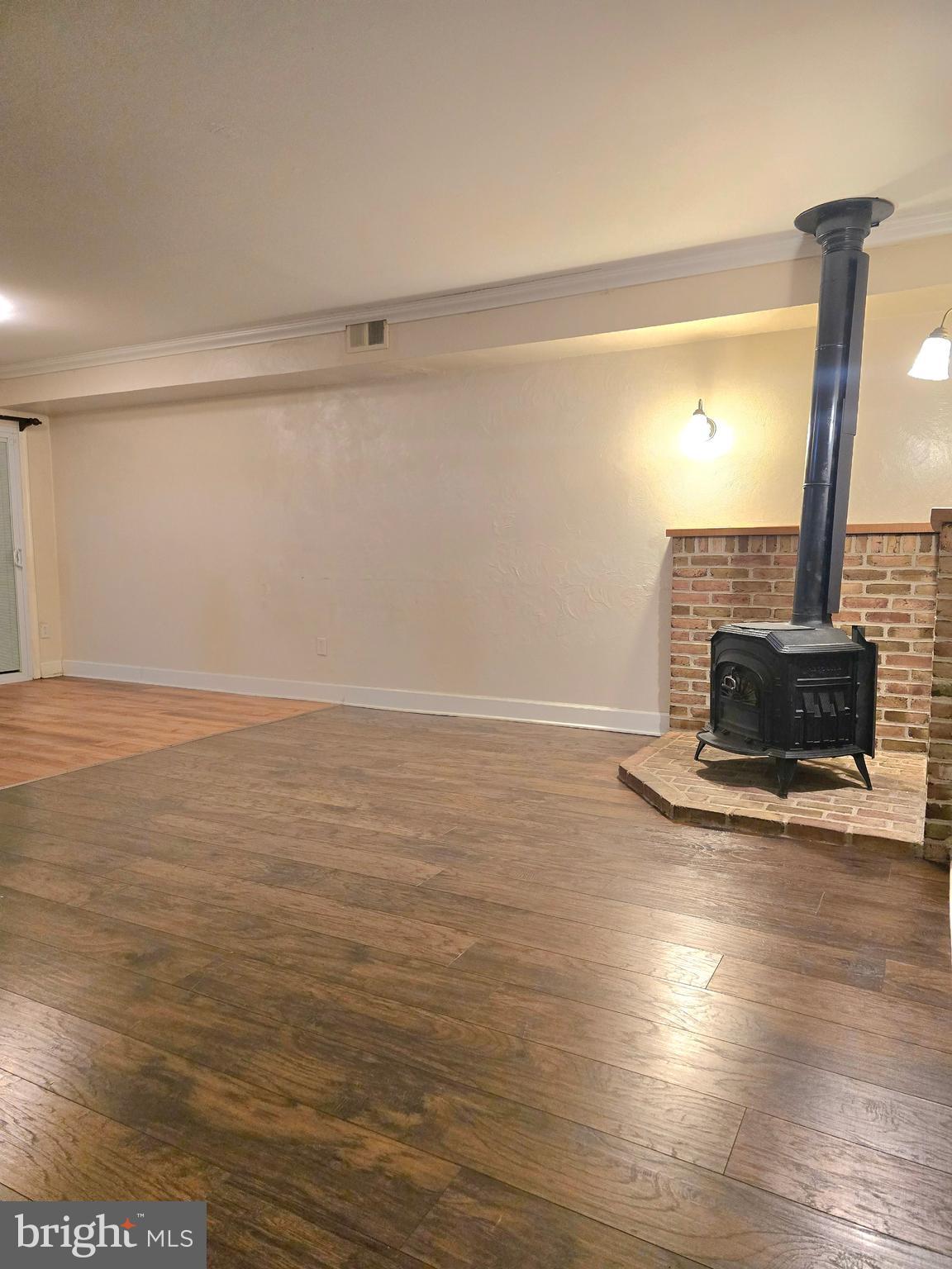 1136 Fox Run Reading, PA 19606 - Photo 5 of 27 a view of empty room with wooden floor and fan