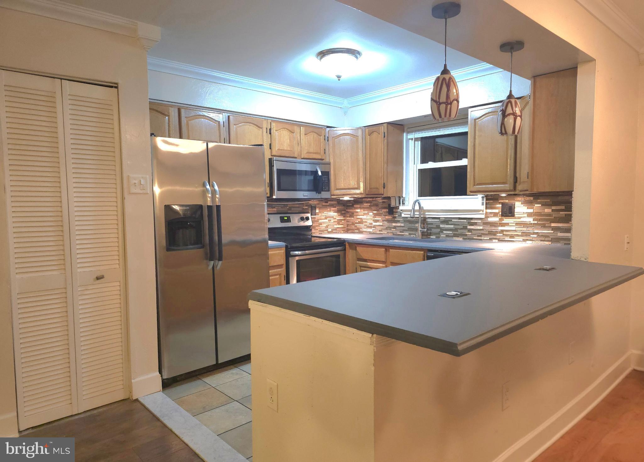 1136 Fox Run Reading, PA 19606 - Photo 7 of 27 a kitchen with stainless steel appliances granite countertop a refrigerator a stove and a sink