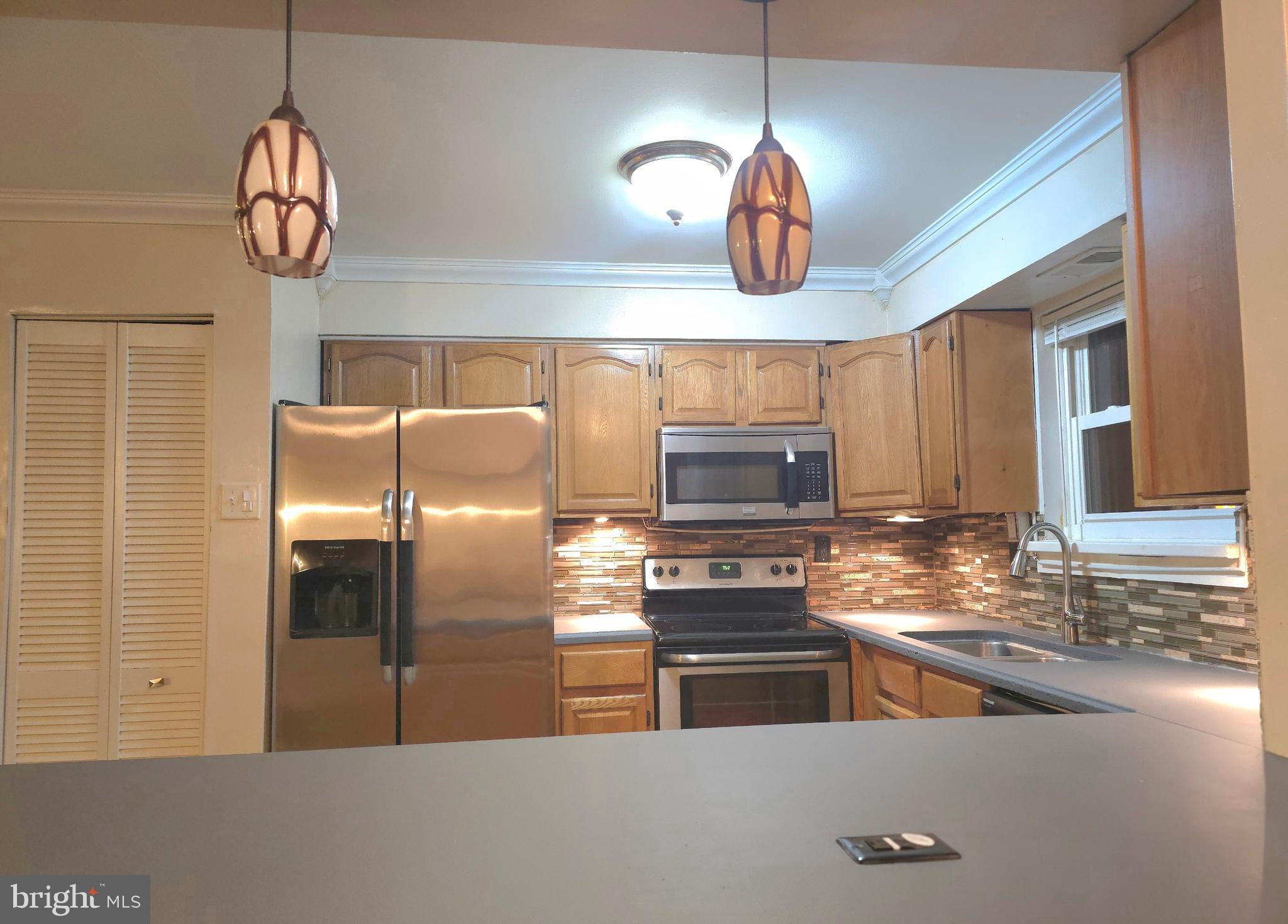 1136 Fox Run Reading, PA 19606 - Photo 9 of 27 a kitchen with stainless steel appliances granite countertop a stove refrigerator and microwave