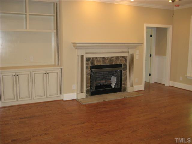862 Shelley Road Raleigh, NC 27609 - Photo 5 of 25 FAMILY ROOM IS OPEN TO THE KITCHEN AND FEATURES A BUILT-IN BOOKCASE, RECESSED LIGHTING, AND GAS LOG FIREPLACE!!!