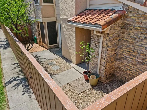 a bathroom with a toilet a sink and shower
