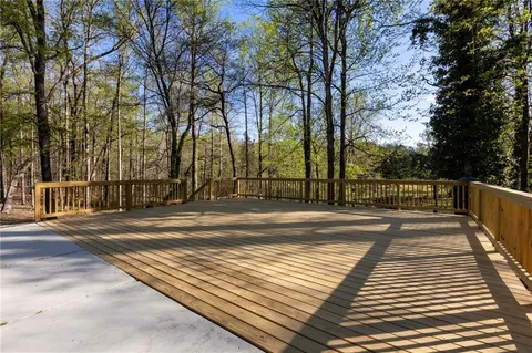a view of a yard with large trees