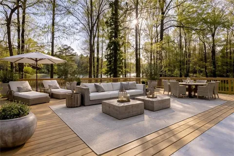 a view of a patio with couches and a fire pit