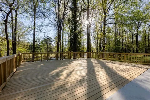 a view of a yard with wooden floor