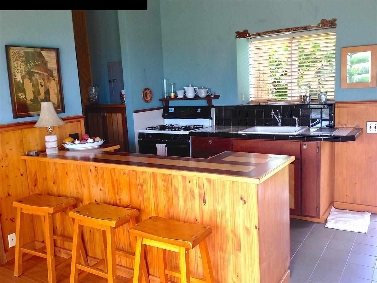 51 South Honokala Road Haiku, HI 96708 - Photo 12 of 28 a kitchen with a sink and cabinets