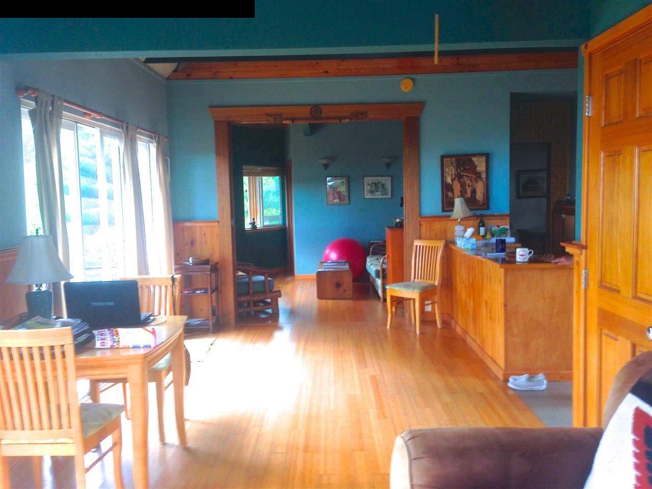 51 South Honokala Road Haiku, HI 96708 - Photo 18 of 28 a living room with furniture and wooden floor