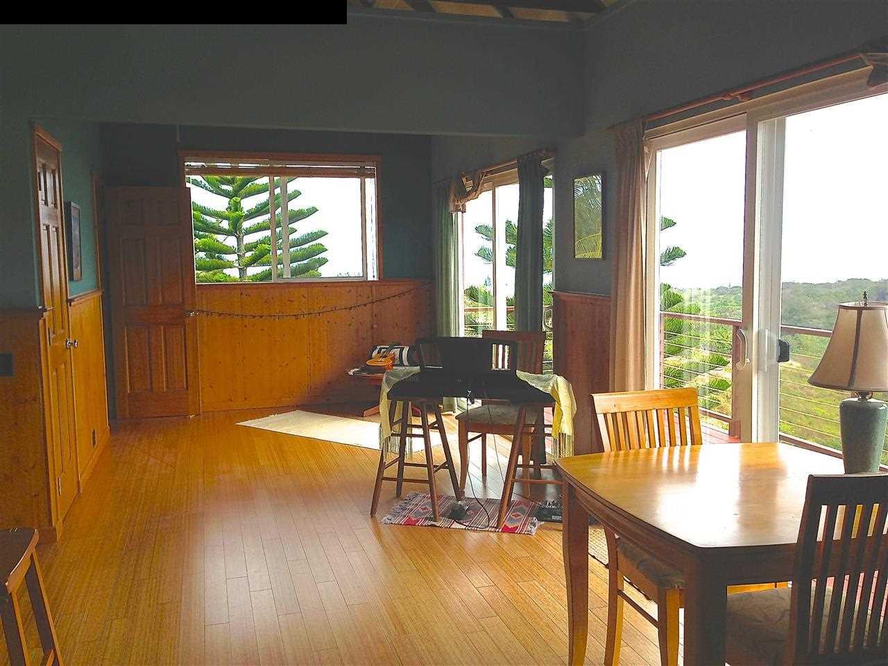 51 South Honokala Road Haiku, HI 96708 - Photo 23 of 28 a view of a dining room with furniture window and wooden floor