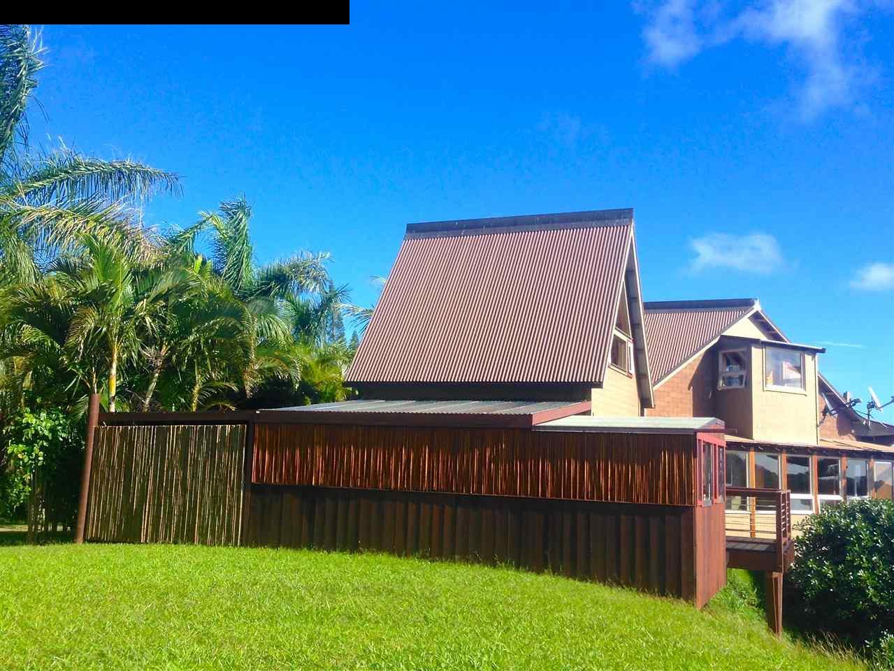 51 South Honokala Road Haiku, HI 96708 - Photo 3 of 28 a view of a backyard with plants and wooden fence