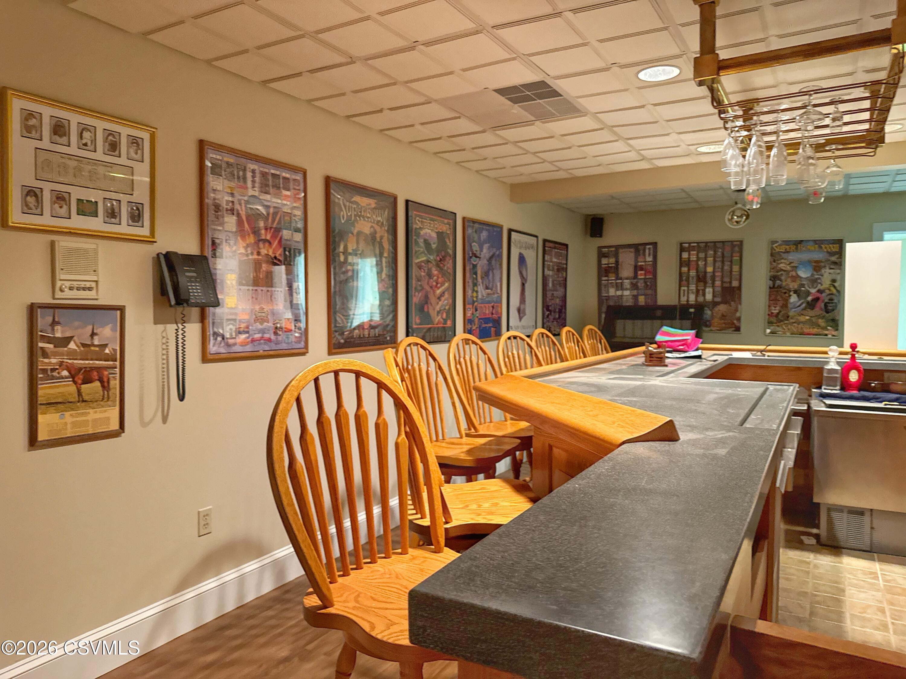 50 Sweet Gum Road Selinsgrove, PA 17870 - Photo 72 of 82 a living room with furniture a flat screen tv and floor to ceiling windows