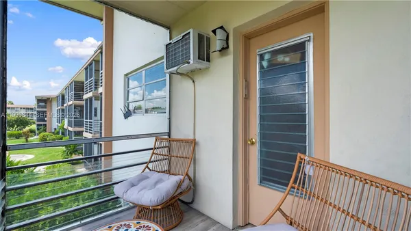 a view of a porch with furniture
