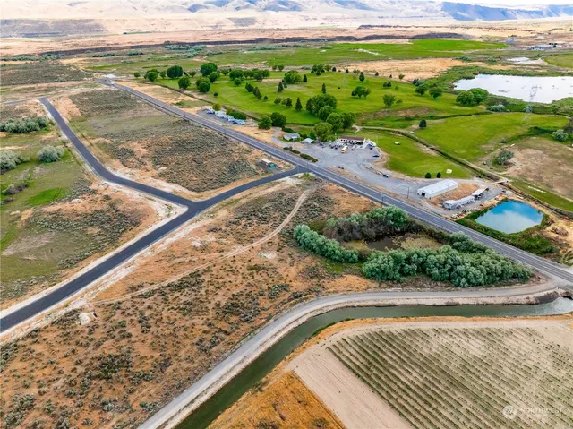 a view of a swimming pool with a yard