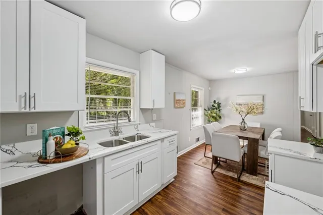 a dining room with furniture and window