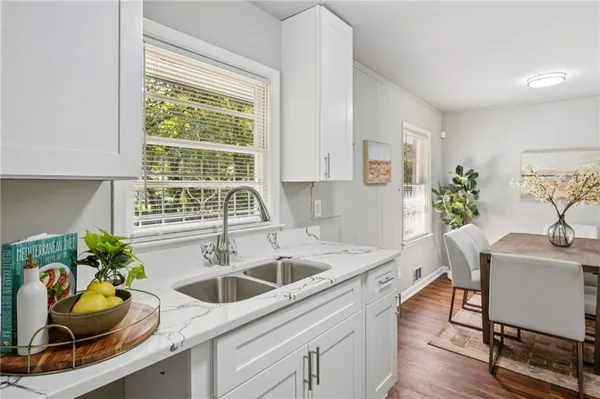 a dining room with furniture and window