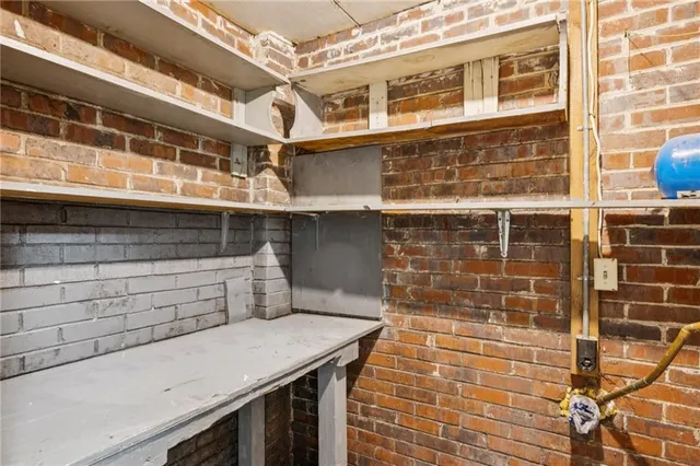 a view of a field of grass and trees