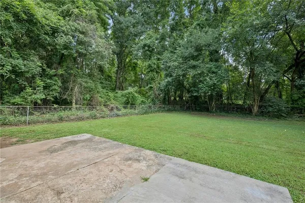 a view of a yard with a trees