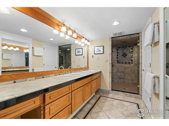 a spacious bedroom with a bed and cabinets