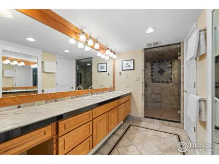 a spacious bedroom with a bed and a couch