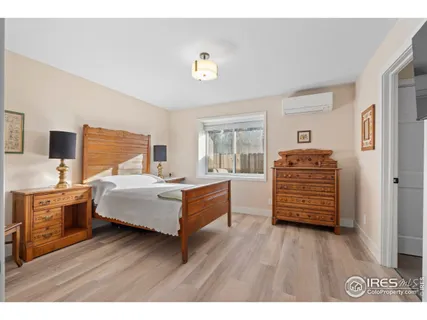 a bedroom with a bed and a potted plant