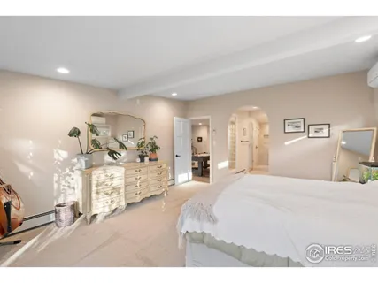 a bathroom with a bathtub a sink a window and a shower