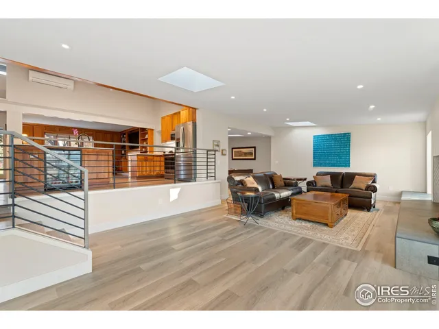 a spacious bedroom with a large bed and a large window