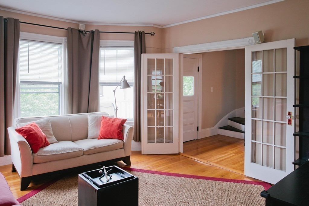 9-11 Campbell Park Somerville, MA 02144 - Photo 13 of 19 a living room with furniture and a window