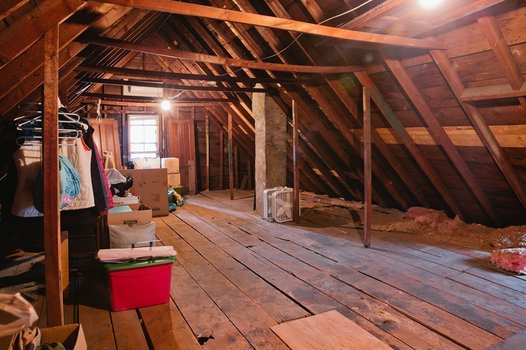 9-11 Campbell Park Somerville, MA 02144 - Photo 17 of 19 a view of walk in closet with clothes and shoes