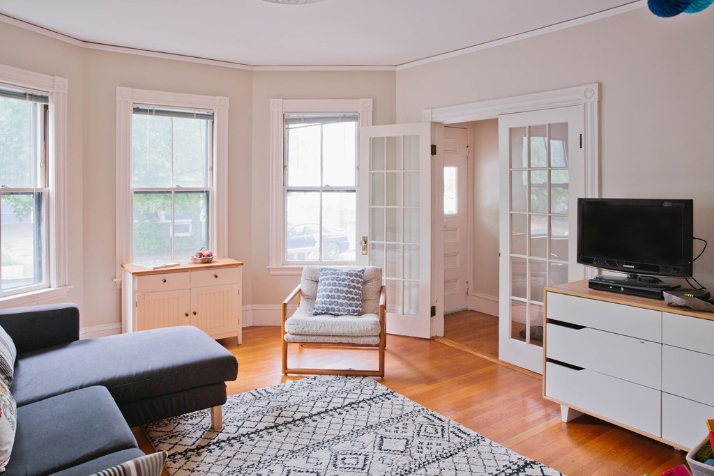 9-11 Campbell Park Somerville, MA 02144 - Photo 3 of 19 a living room with furniture and a flat screen tv