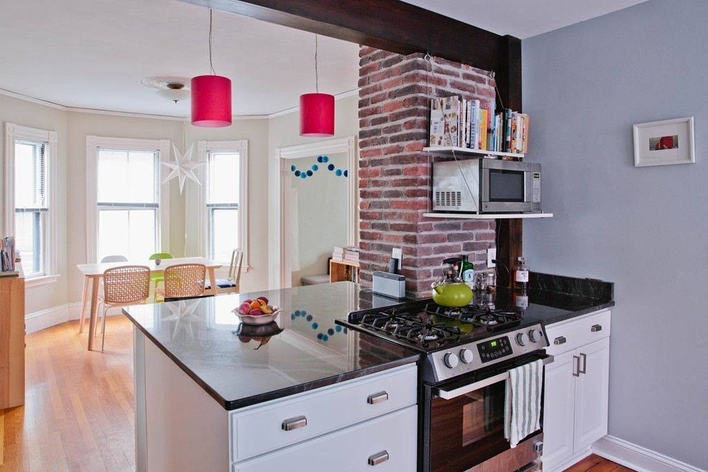 9-11 Campbell Park Somerville, MA 02144 - Photo 5 of 19 a kitchen with stainless steel appliances granite countertop a stove and a sink