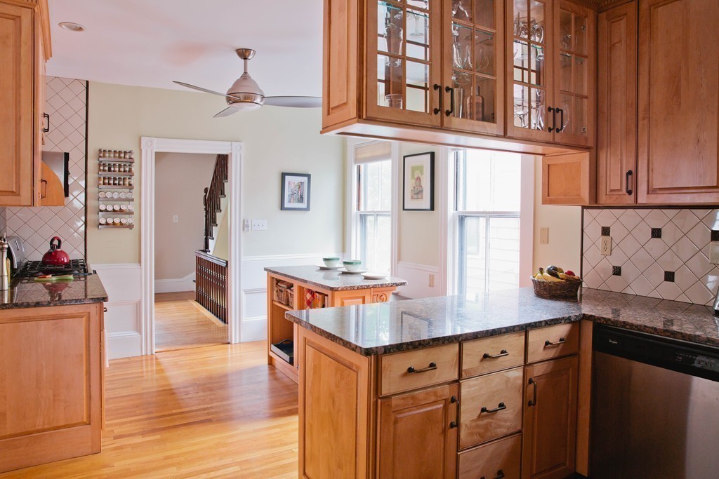 9-11 Campbell Park Somerville, MA 02144 - Photo 9 of 19 a kitchen with stainless steel appliances granite countertop a stove and a sink with cabinets