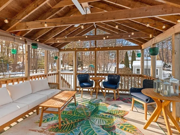 a outdoor space with patio lots of furniture and white umbrellas