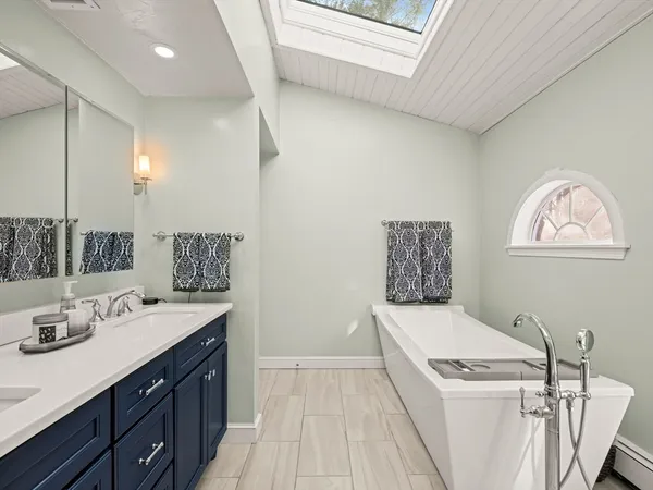 a bathroom with a sink a mirror and a toilet