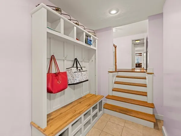 a view of a room with stairs and furniture