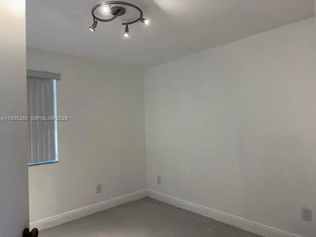 an empty room with a white door