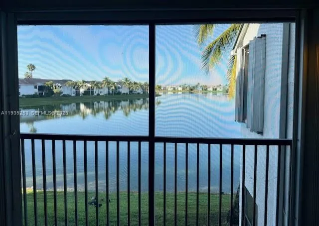 a white house with palm trees in front of it