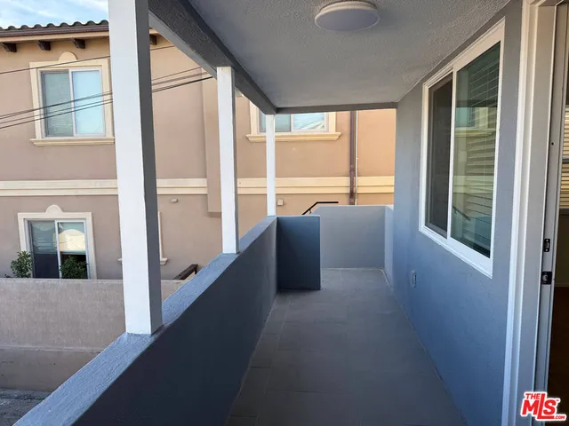 a view of balcony with furniture