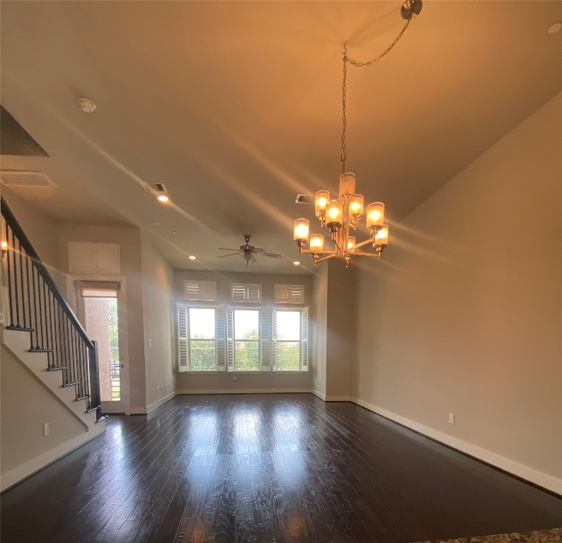 115 East 2nd Street Houston, TX 77007 - Photo 12 of 37 a view of a room with wooden floor and chandelier