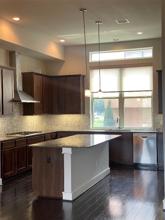 115 East 2nd Street Houston, TX 77007 - Photo 17 of 37 a kitchen with stainless steel appliances granite countertop a sink a stove and a wooden floor