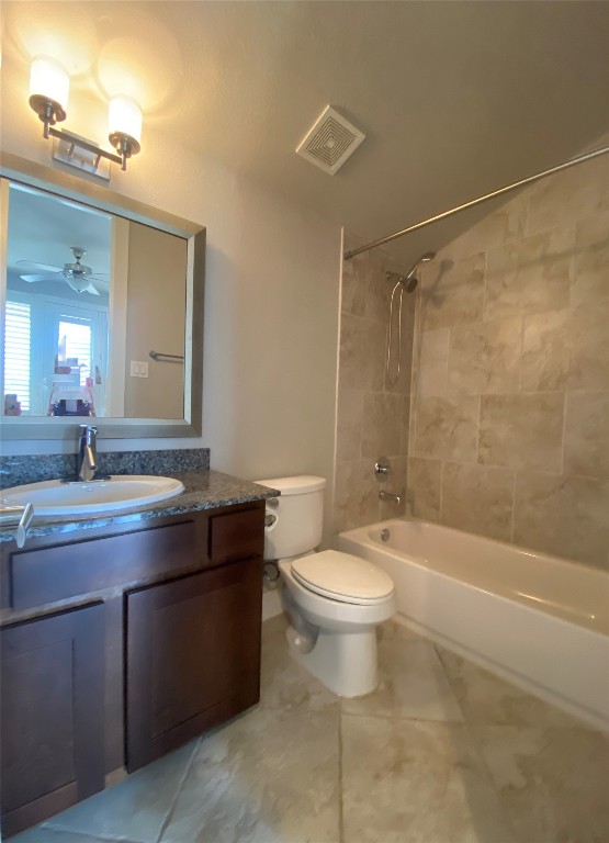 115 East 2nd Street Houston, TX 77007 - Photo 30 of 37 a bathroom with a granite countertop sink a toilet a mirror and bathtub
