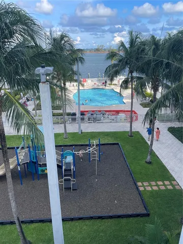 an outdoor space with furniture and garden
