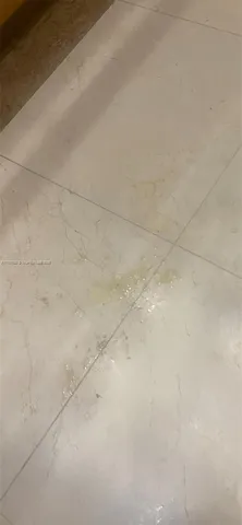 a bathroom with a grey shower