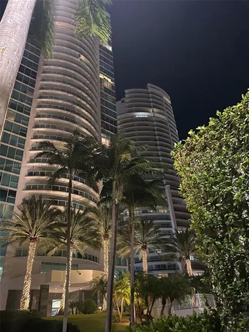 a view of a tree with building