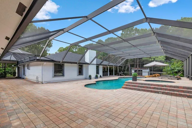 a view of a house with a yard and plants