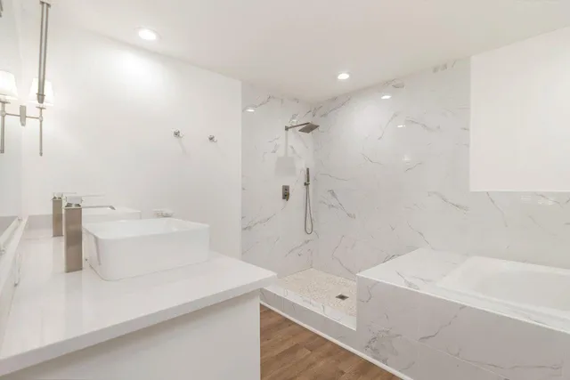 a bathroom with a bathtub and a sink