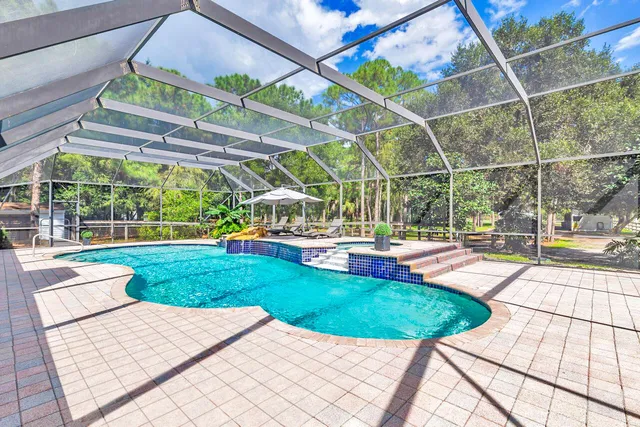 a view of a swimming pool with a patio