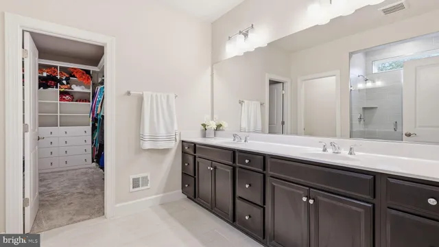 a bedroom with a bed and a book shelf